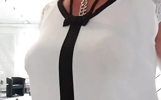 Juli',s shirt reveals her boob