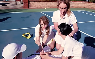 Female tennis players work as a team during outdoor threesome sex